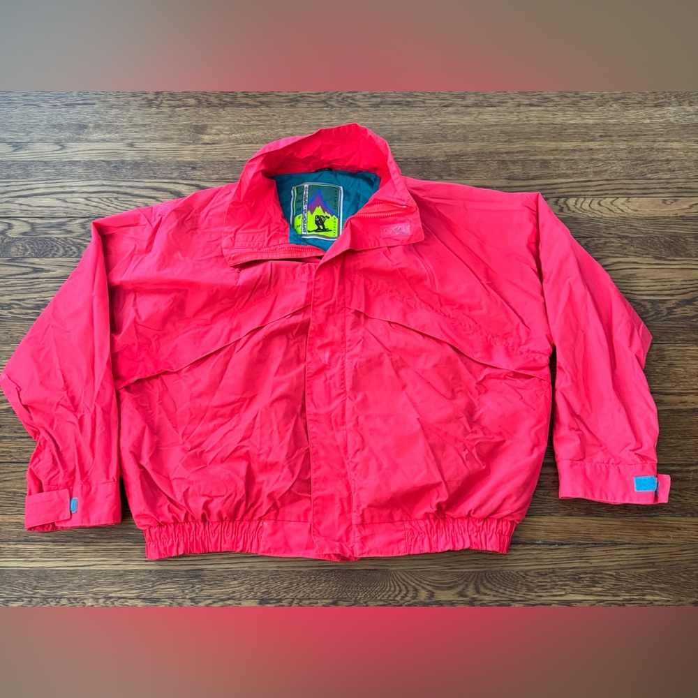 vintage 1980s or 1990s red and teal windbreaker features a Steep Slopes Fashion